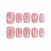 Rose quartz pink shimmer press-on nails. Short square gel false nails with magnetic cat-eye design.
